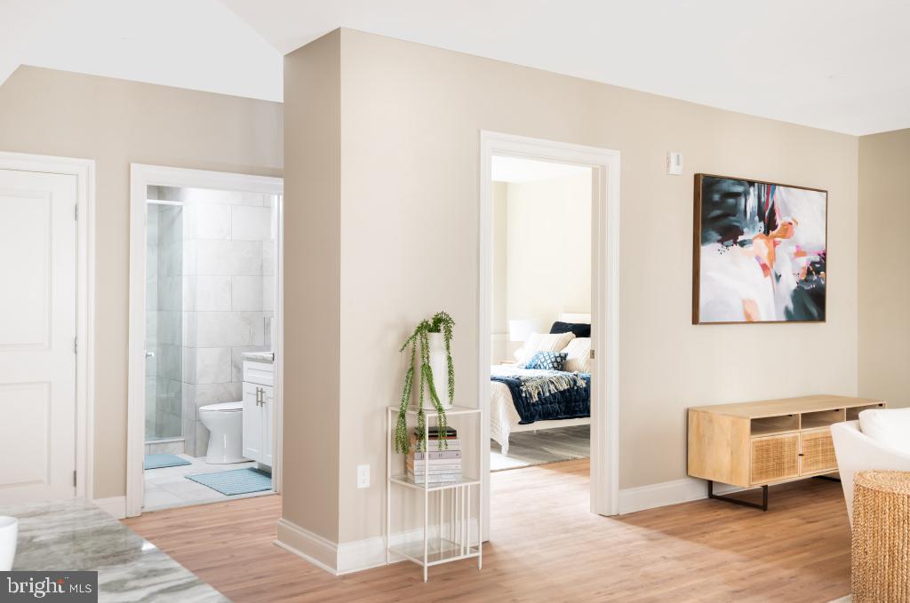 1420-22 Chestnut Street, Unit 301 Philadelphia, PA 19102 - Photo 10 of 29 a living room with furniture and a painting on the wall