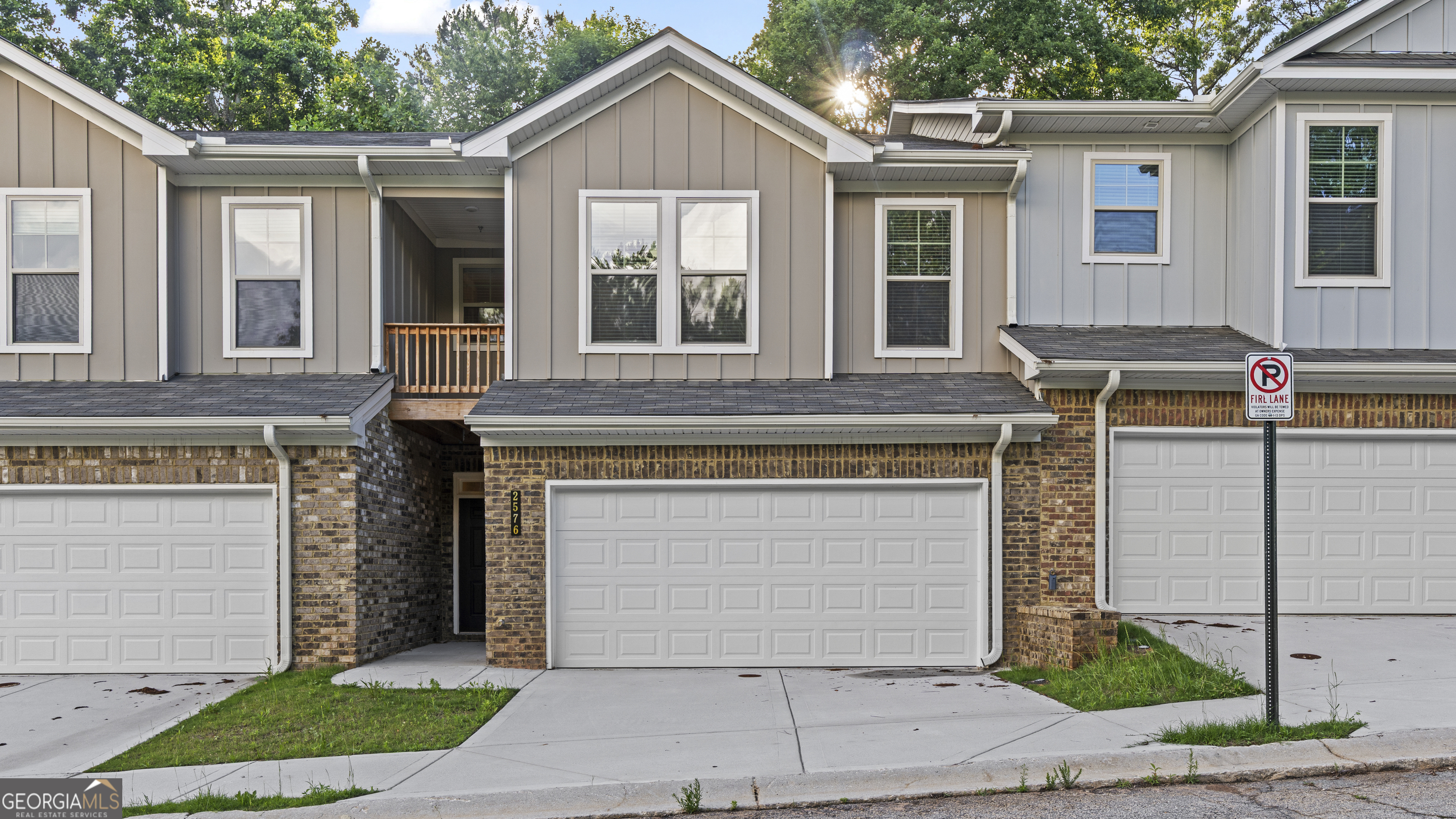 2594 Mills Commons Drive Decatur, GA 30034 - Photo 1 of 10 a front view of a house with a garden