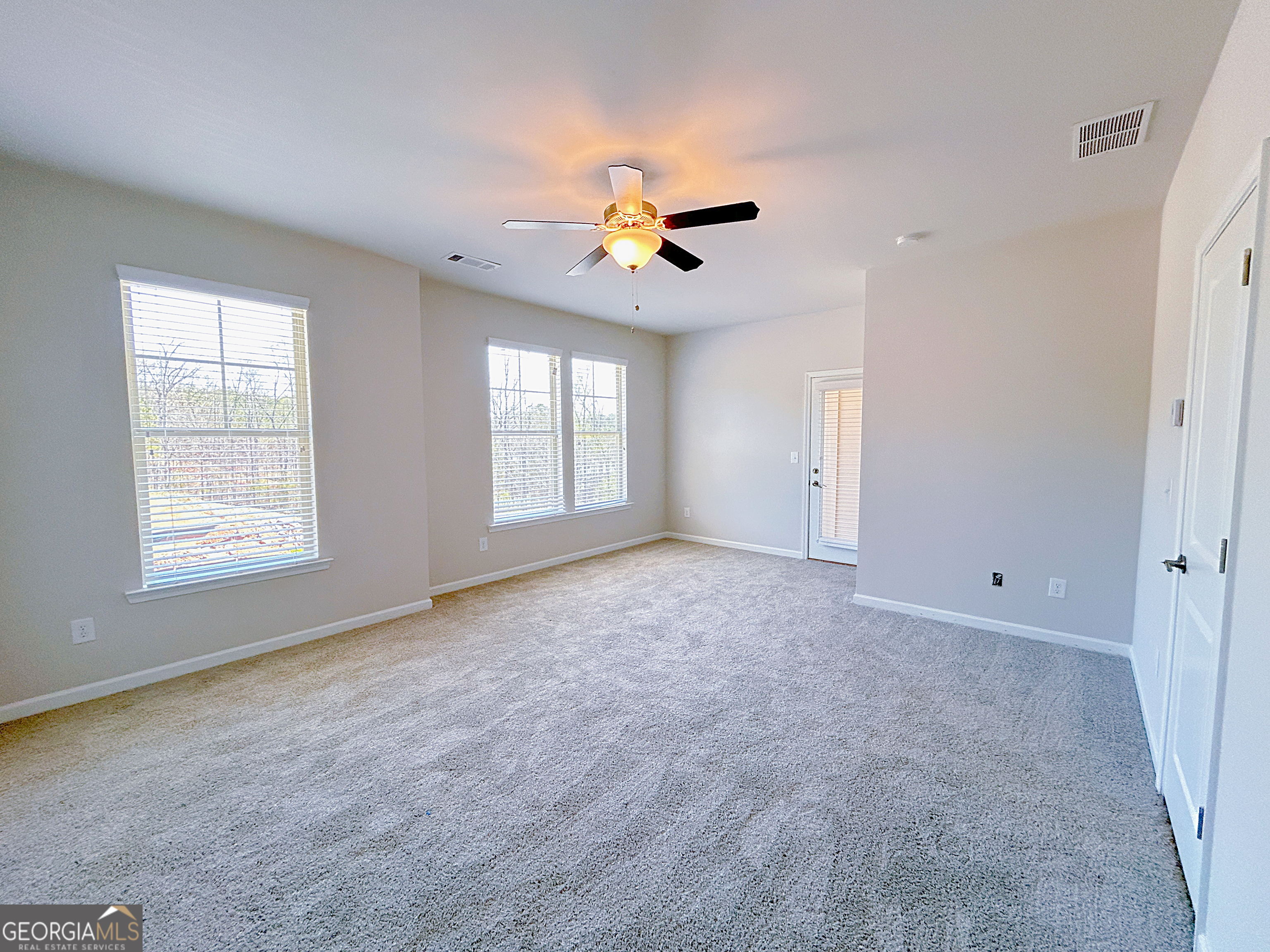2594 Mills Commons Drive Decatur, GA 30034 - Photo 6 of 10 a view of an empty room with a window