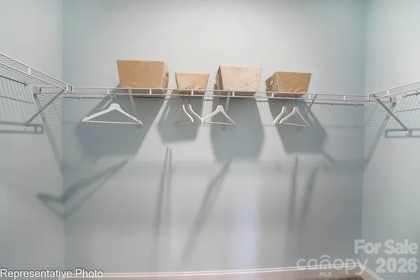 a view of a room with racks on the wall