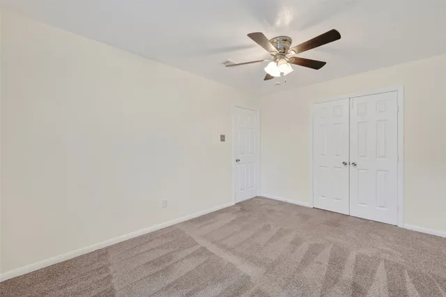 a view of a ceiling fan with wooden floor