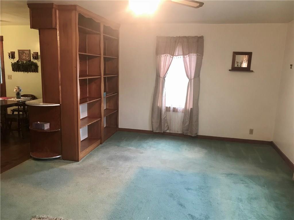 5124 Purchase Line Road Commodore, PA 15729 - Photo 14 of 25 Bookshelf storage could be removed if open plan to kitchen is desired.