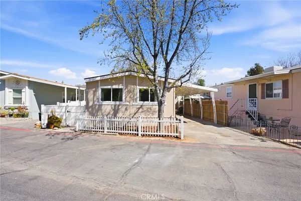 a view of a house with outdoor space and porch