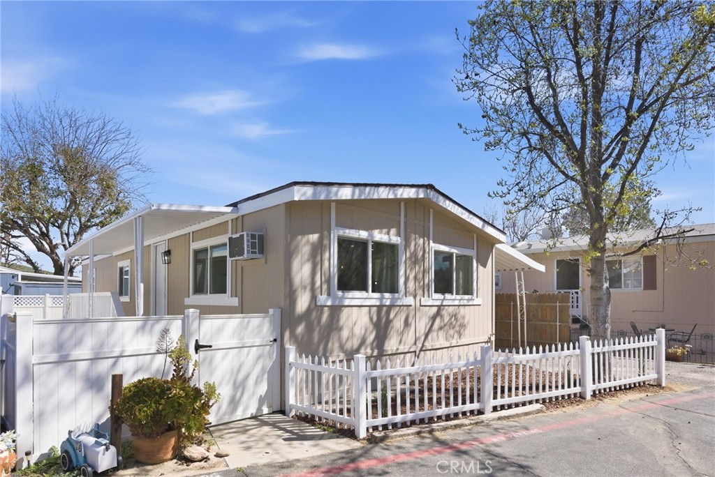 30000 Hasley Canyon Road, Unit 16 Castaic, CA 91384 - Photo 2 of 34 a front view of a house with a porch