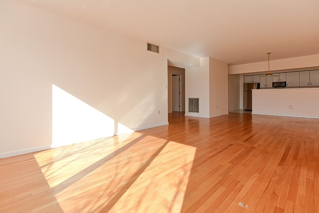 59 Brainerd Road, Unit 406 Boston, MA 02134 - Photo 11 of 19 a view of a room with wooden floor
