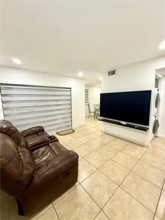 a living room with a couch and a flat screen tv