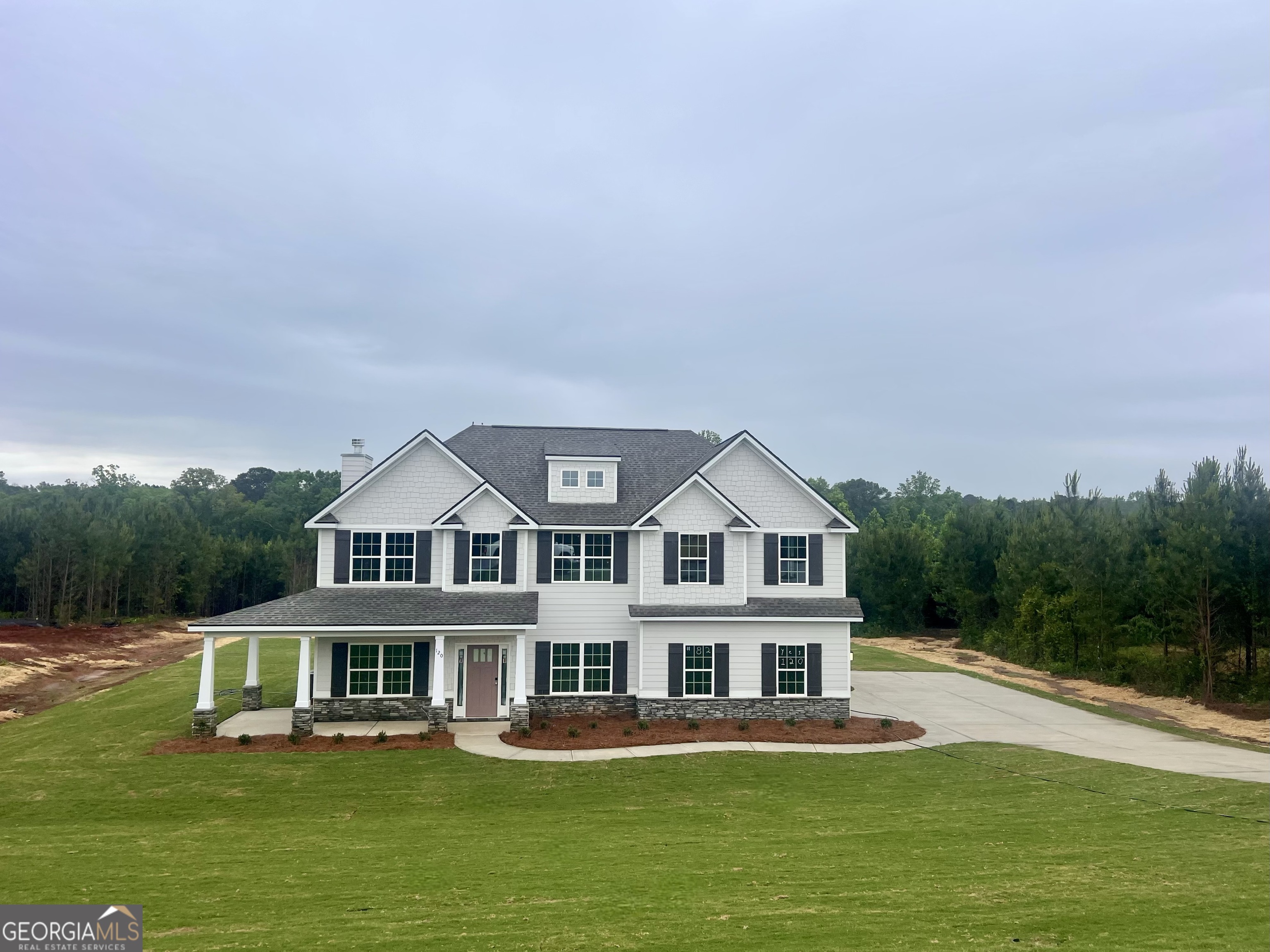 120 Hawkeye Trail, Unit 82 Fortson, GA 31808 - Photo 1 of 4 a front view of a house with garden and swimming pool