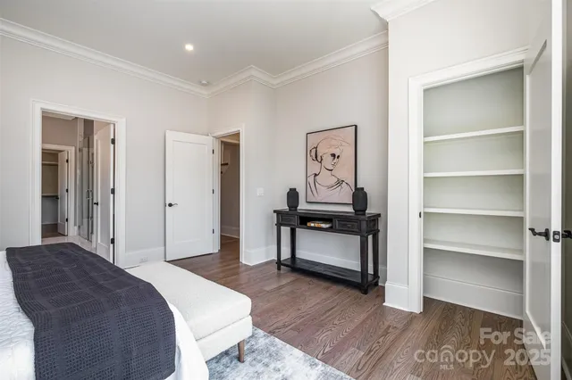 a bedroom with a bed and a cabinets
