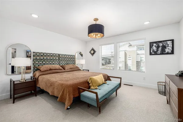 a bedroom with furniture and a window