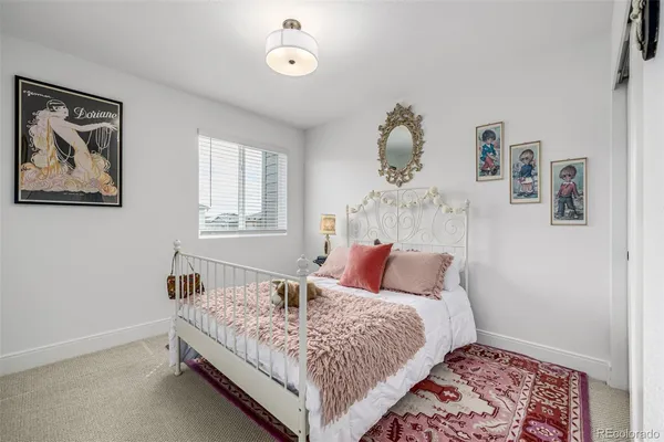a bedroom with furniture and window