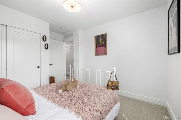 a view of room with window and furniture