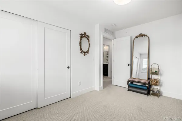 a view of a hallway with washer and dryer