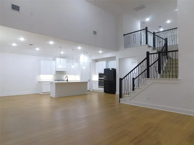 a view of a kitchen with a sink and a microwave