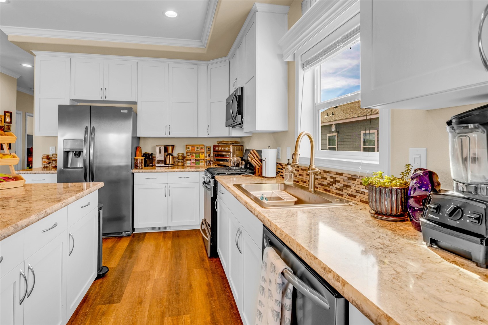 108 A Sun Rock Road, Unit A Fairplay, CO 80440 - Photo 6 of 48 a kitchen with a sink stove and cabinets