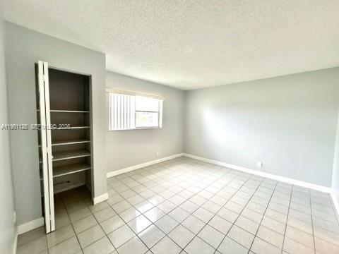 8020 North Colony Circle, Unit 203 Tamarac, FL 33321 - Photo 11 of 13 a view of an empty room and window