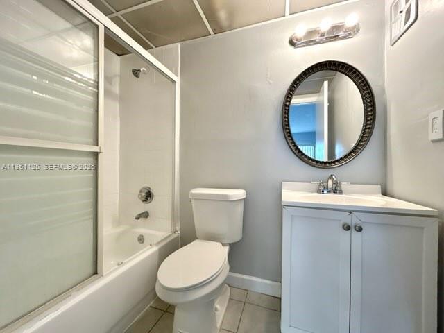 8020 North Colony Circle, Unit 203 Tamarac, FL 33321 - Photo 6 of 13 a bathroom with a toilet sink and mirror