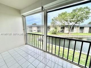 8020 North Colony Circle, Unit 203 Tamarac, FL 33321 - Photo 7 of 13 a view of a room with a large window