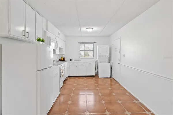 a kitchen with a refrigerator a sink and dishwasher