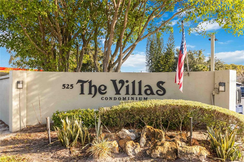 525 South Conway Road, Unit 29 Orlando, FL 32807 - Photo 2 of 29 a view of outdoor space with signage and flags