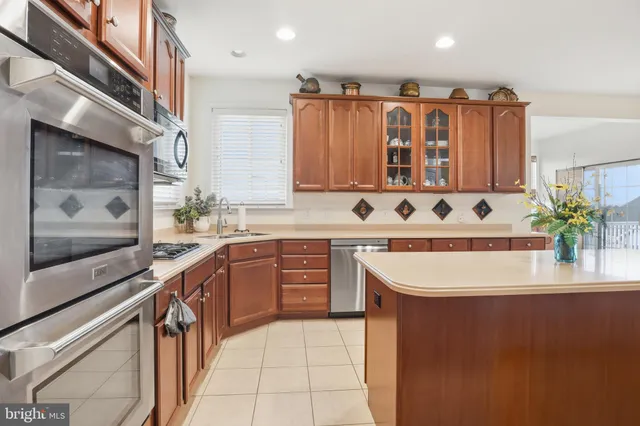 a bathroom with a sink vanity granite tub and shower