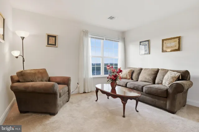 a white bath tub sitting next to a window