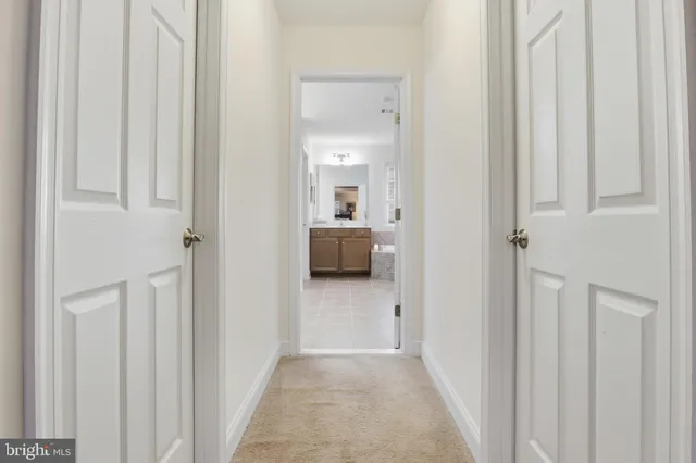a view of a patio with table and chairs and potted plants