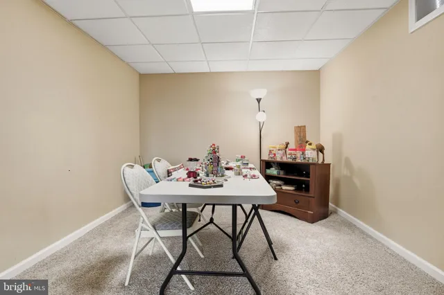 an aerial view of residential houses with outdoor space and swimming pool