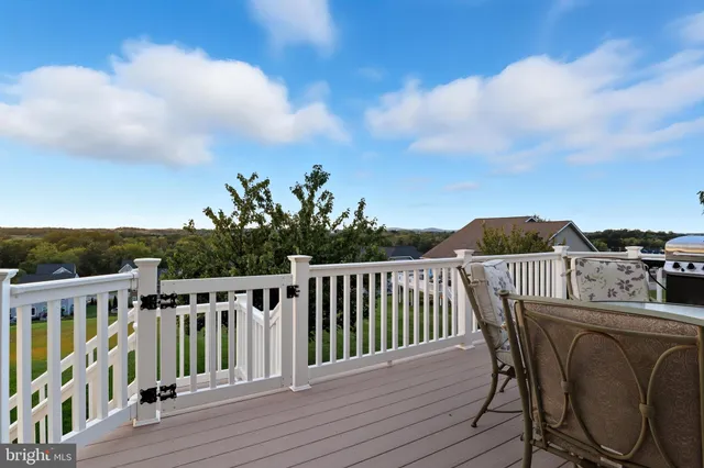 an aerial view of a houses with a lake view
