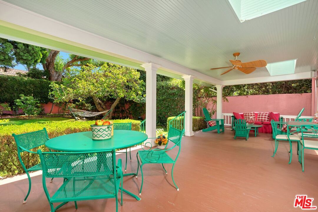 208 South Plymouth Boulevard Los Angeles, CA 90004 - Photo 24 of 44 a view of a dining room with furniture a rug and a floor to ceiling window