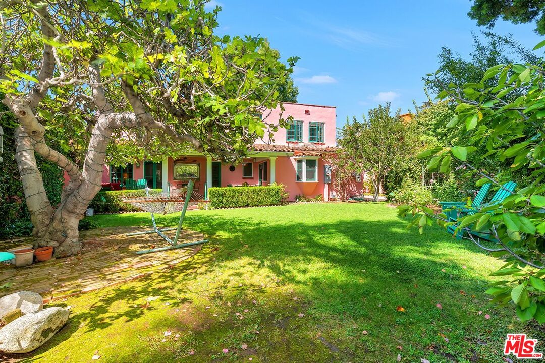 208 South Plymouth Boulevard Los Angeles, CA 90004 - Photo 26 of 44 a view of house in front of a big yard with large trees