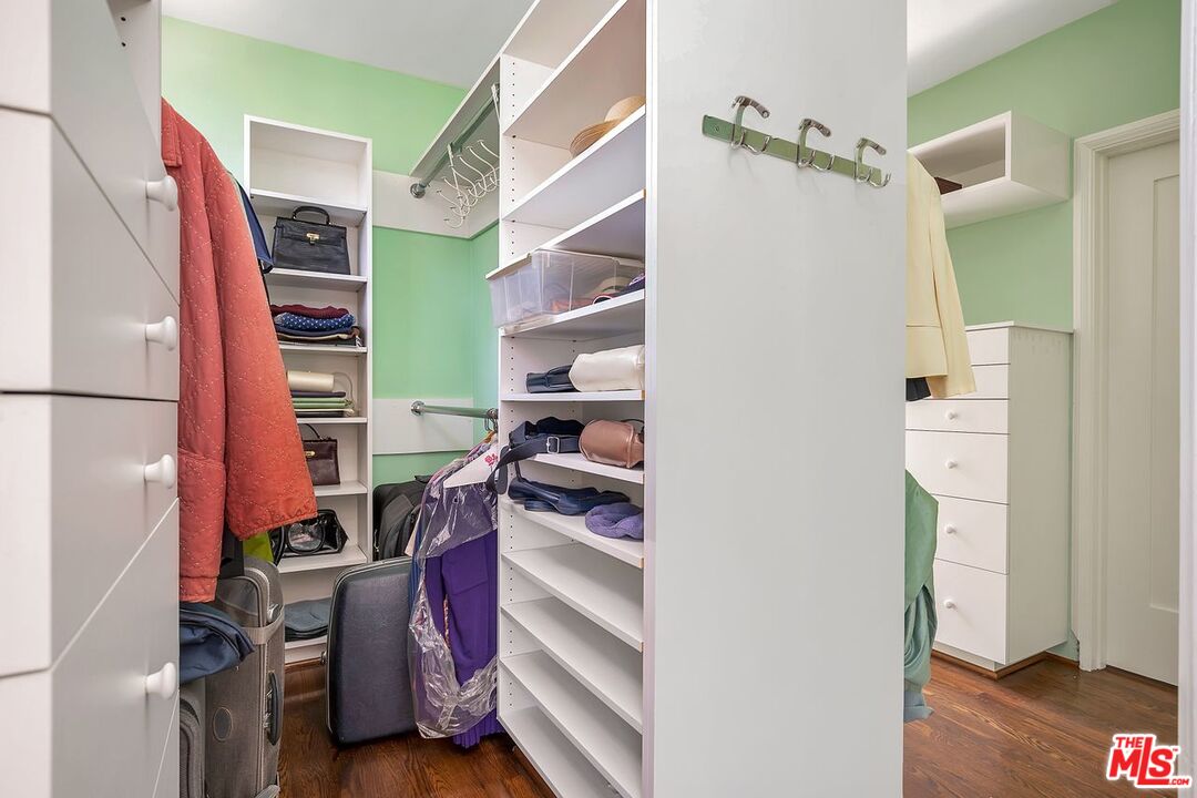 208 South Plymouth Boulevard Los Angeles, CA 90004 - Photo 44 of 44 a view of walk in closet with clothes and shoes