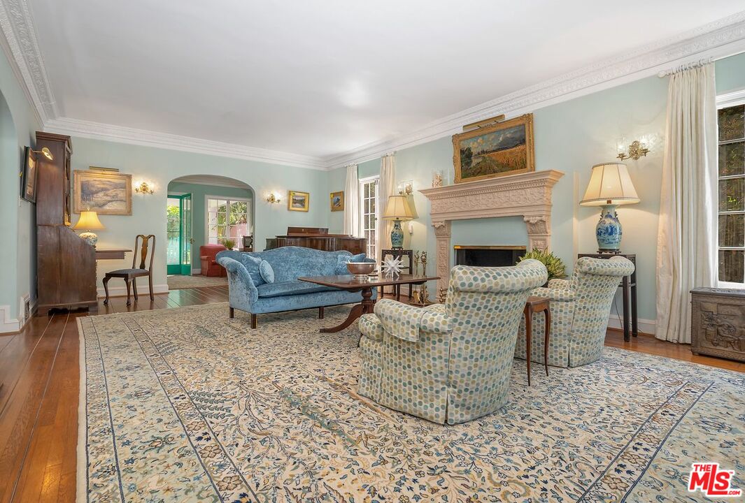 208 South Plymouth Boulevard Los Angeles, CA 90004 - Photo 10 of 44 a living room with furniture and a fireplace