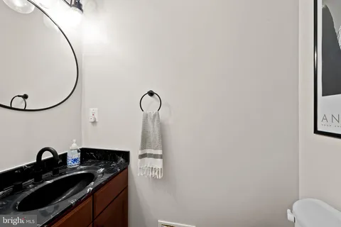 a close view of a sink a mirror and a shower in a bathroom