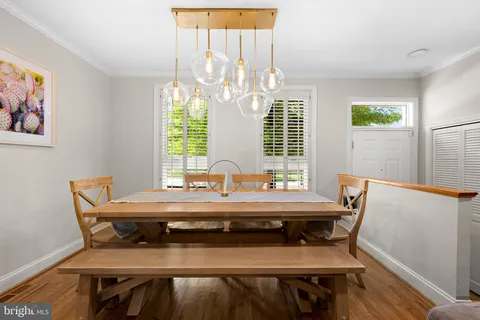 a view of a dining room with furniture and window