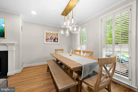 a dining room with a table and chairs