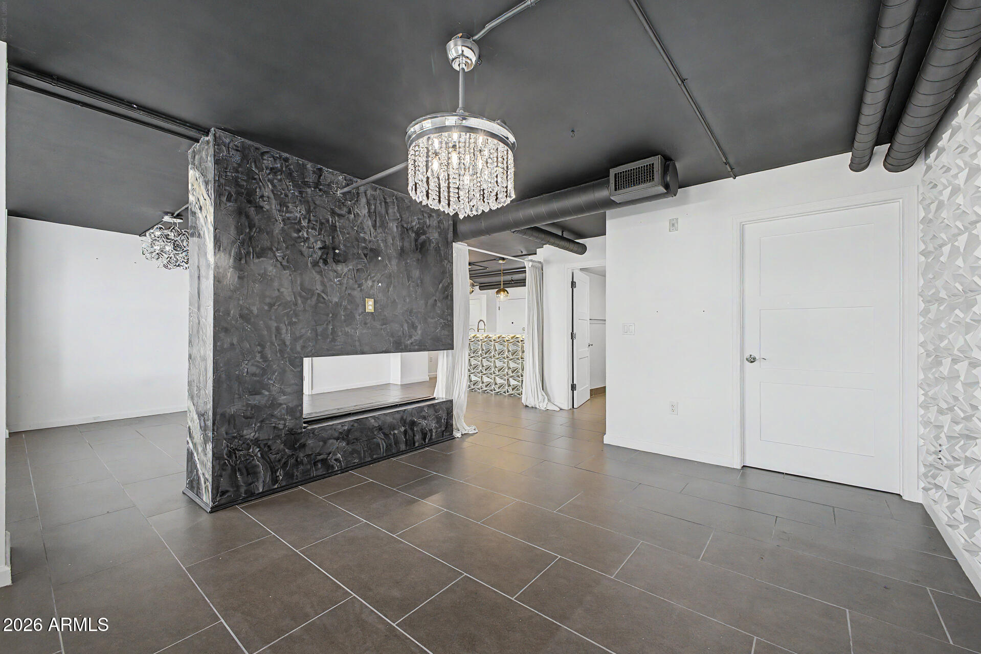 535 West Thomas Road, Unit 513 Phoenix, AZ 85013 - Photo 11 of 33 a view of a hallway with a chandelier
