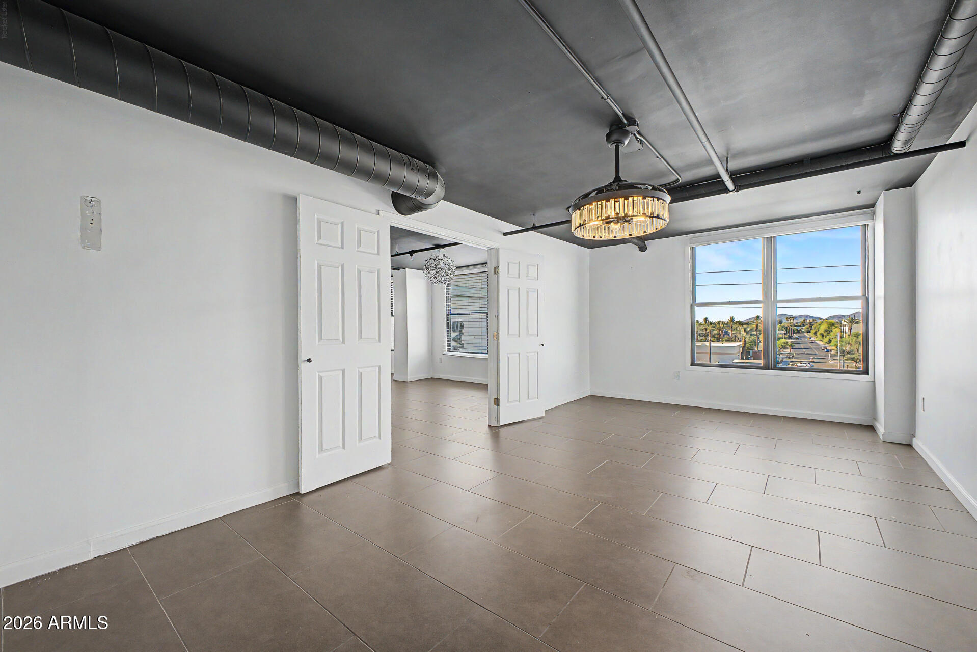 535 West Thomas Road, Unit 513 Phoenix, AZ 85013 - Photo 19 of 33 a view interior of a house window and chandelier