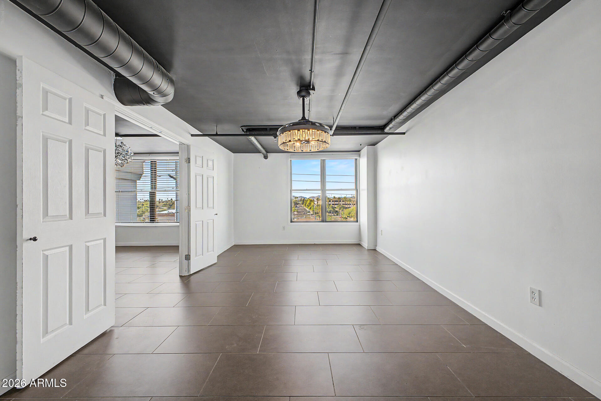 535 West Thomas Road, Unit 513 Phoenix, AZ 85013 - Photo 20 of 33 a view of hallway with chandelier and stairs