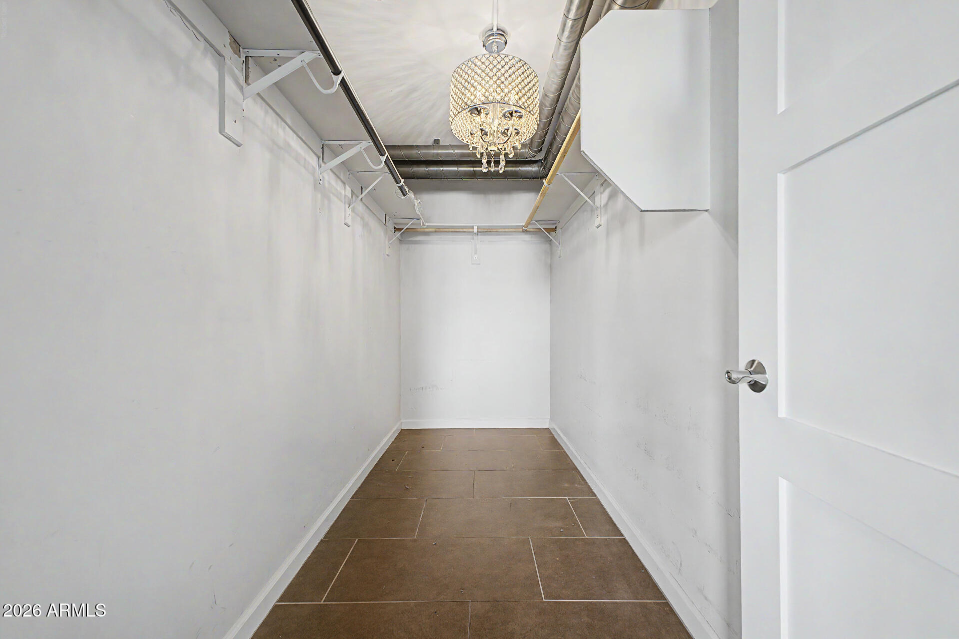 535 West Thomas Road, Unit 513 Phoenix, AZ 85013 - Photo 25 of 33 a view of a hallway with stairs