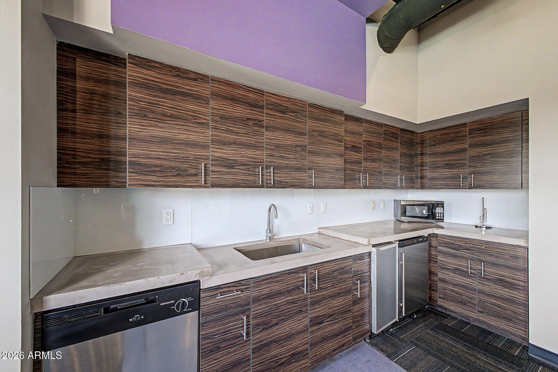 535 West Thomas Road, Unit 513 Phoenix, AZ 85013 - Photo 29 of 33 a kitchen with a sink and cabinets