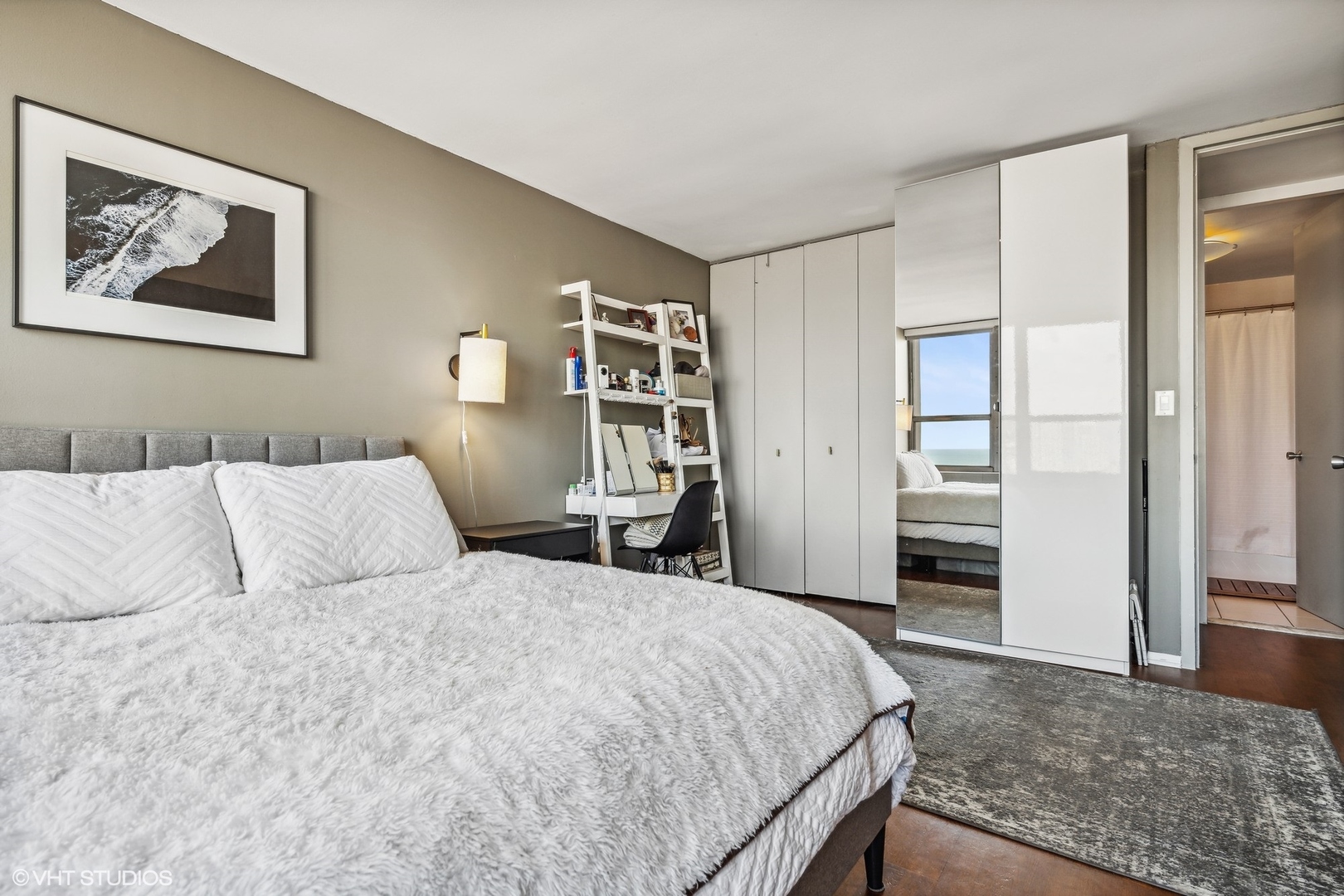 655 West Irving Park Road, Unit 1912 Chicago, IL 60613 - Photo 11 of 29 a bed room with a bed and a refrigerator