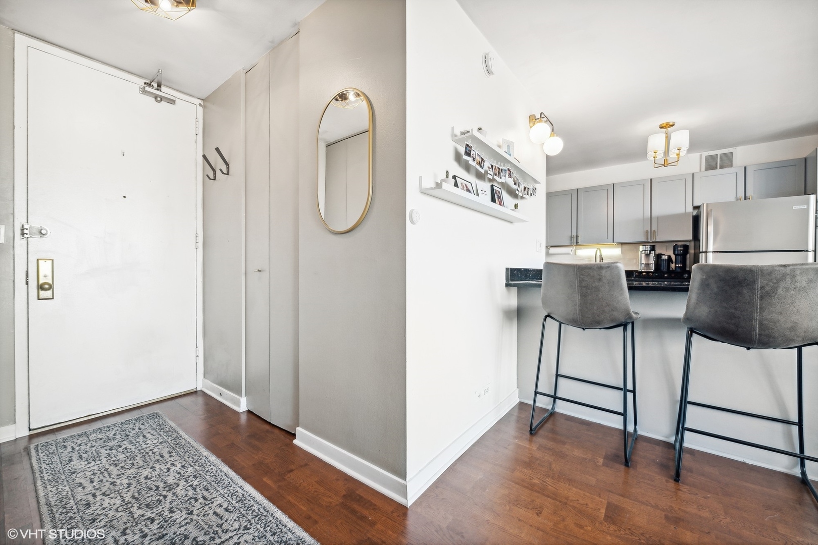 655 West Irving Park Road, Unit 1912 Chicago, IL 60613 - Photo 13 of 29 a view of kitchen with furniture and a refrigerator