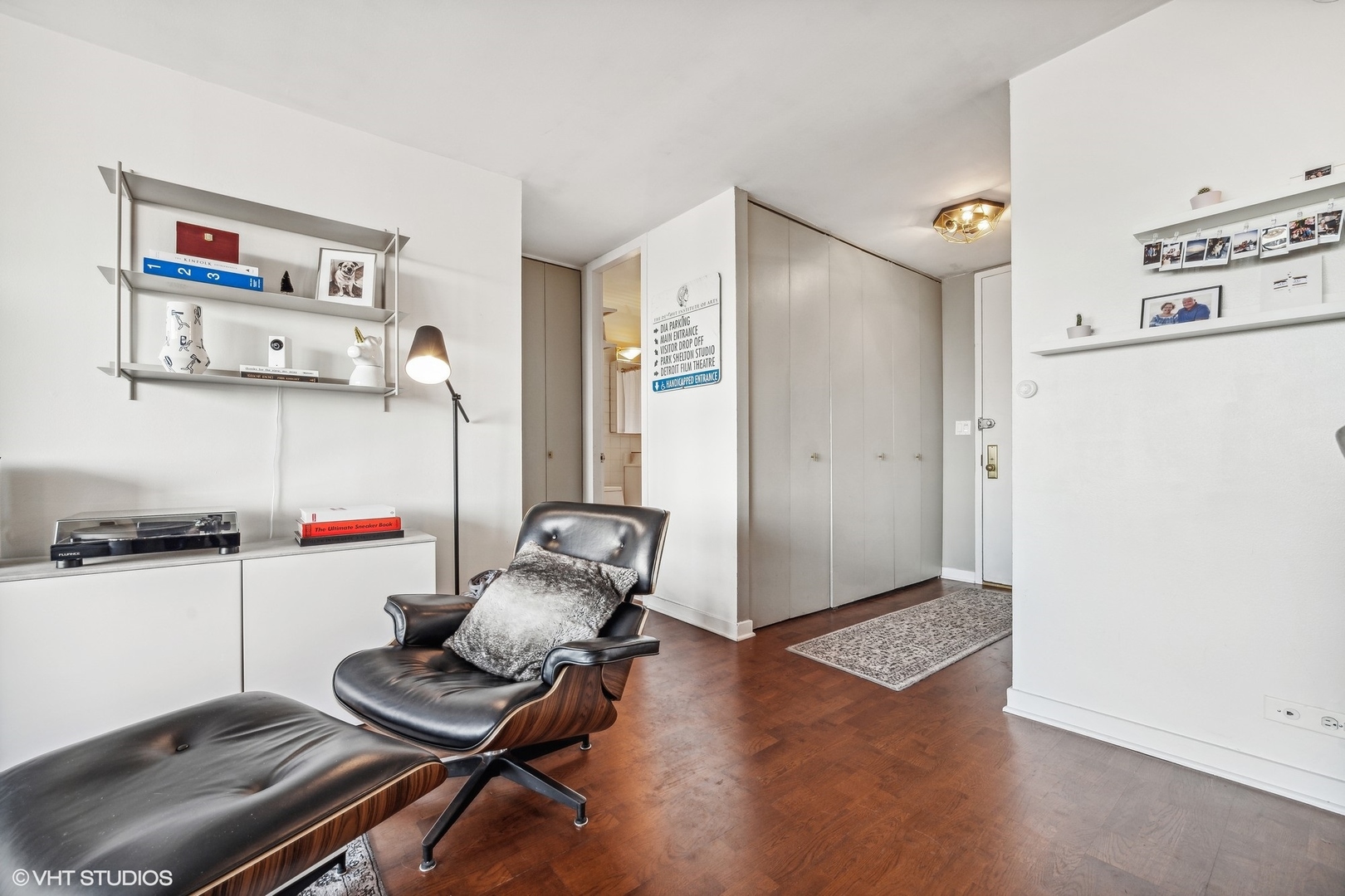 655 West Irving Park Road, Unit 1912 Chicago, IL 60613 - Photo 14 of 29 a living room with furniture and a wooden floor