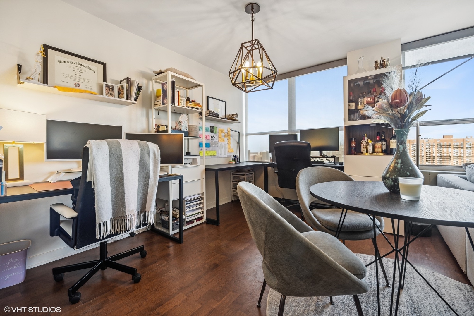655 West Irving Park Road, Unit 1912 Chicago, IL 60613 - Photo 18 of 29 a view of a dining room with furniture window and wooden floor