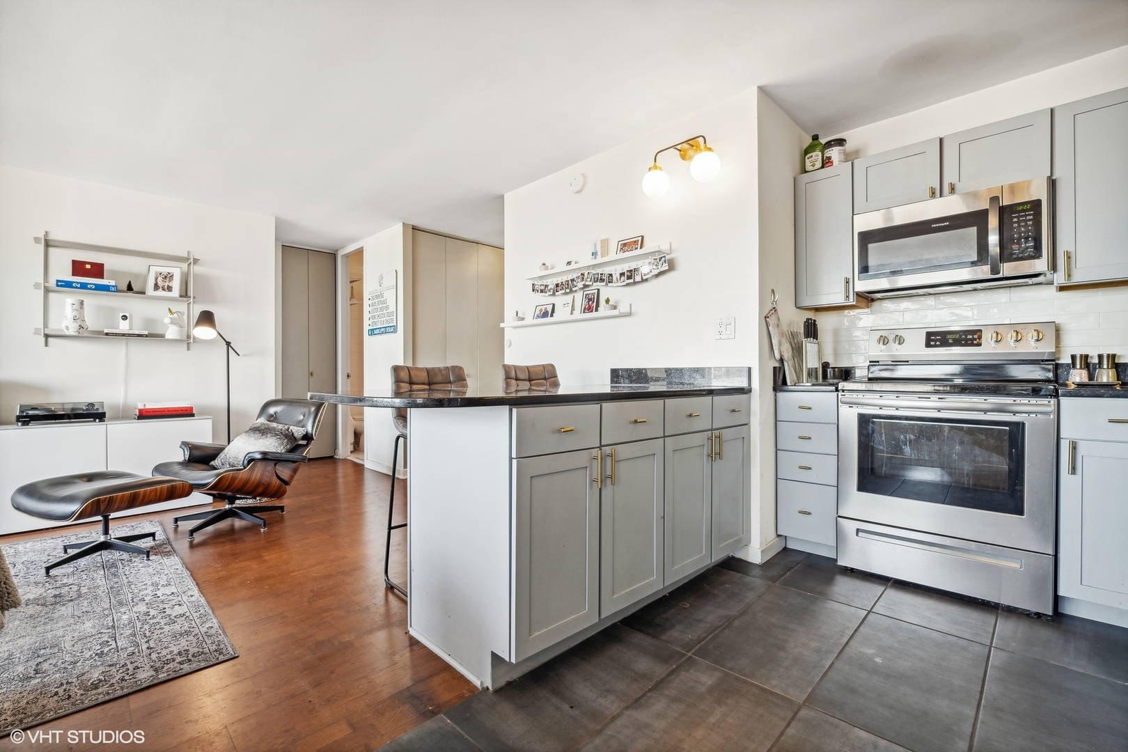655 West Irving Park Road, Unit 1912 Chicago, IL 60613 - Photo 7 of 29 a kitchen with a stove a sink and a refrigerator