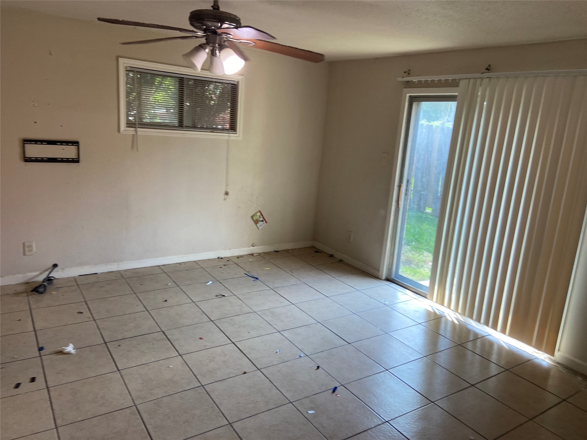 8730 Cowart Street Houston, TX 77029 - Photo 7 of 25 a view of an empty room and chandelier fan