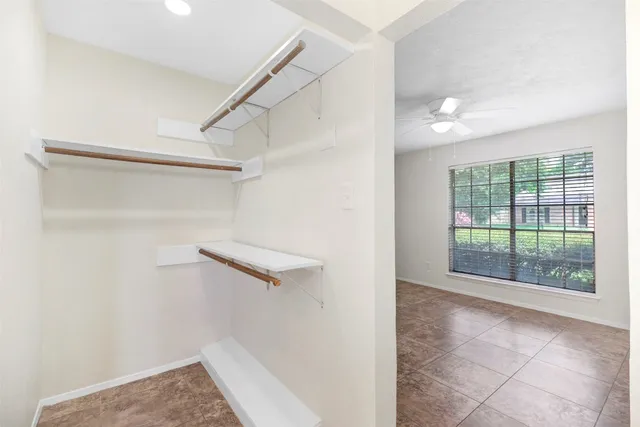 a view of storage and utility room with closet