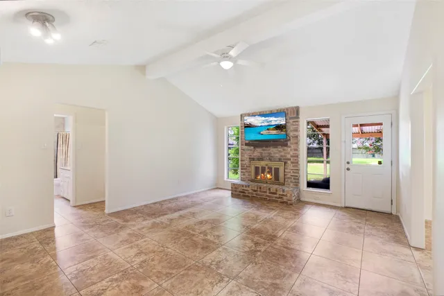 a view of empty room with natural light
