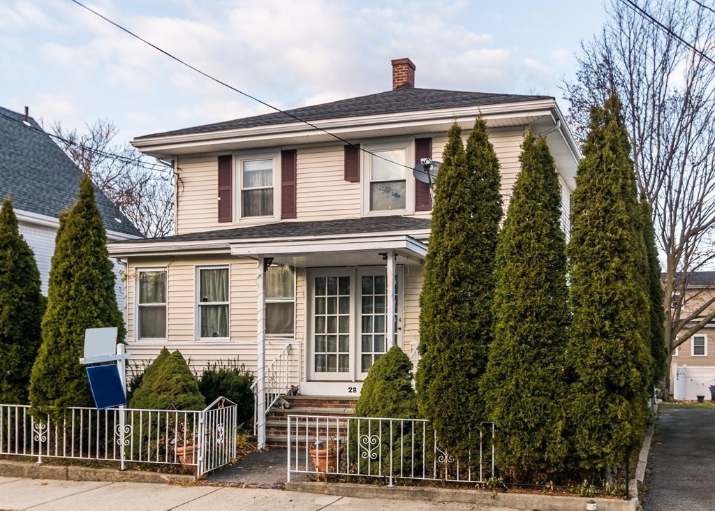 28 Bolton Street Waltham, MA 02453 - Photo 2 of 22 a front view of a house with a garden