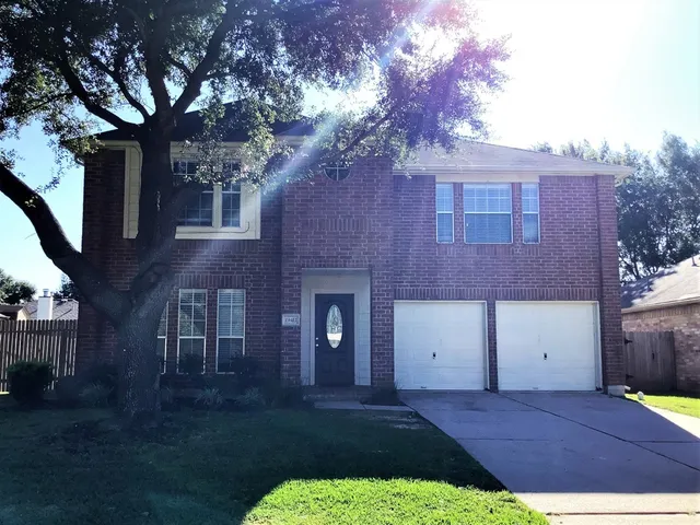 a view of a yard in front of a house with a yard